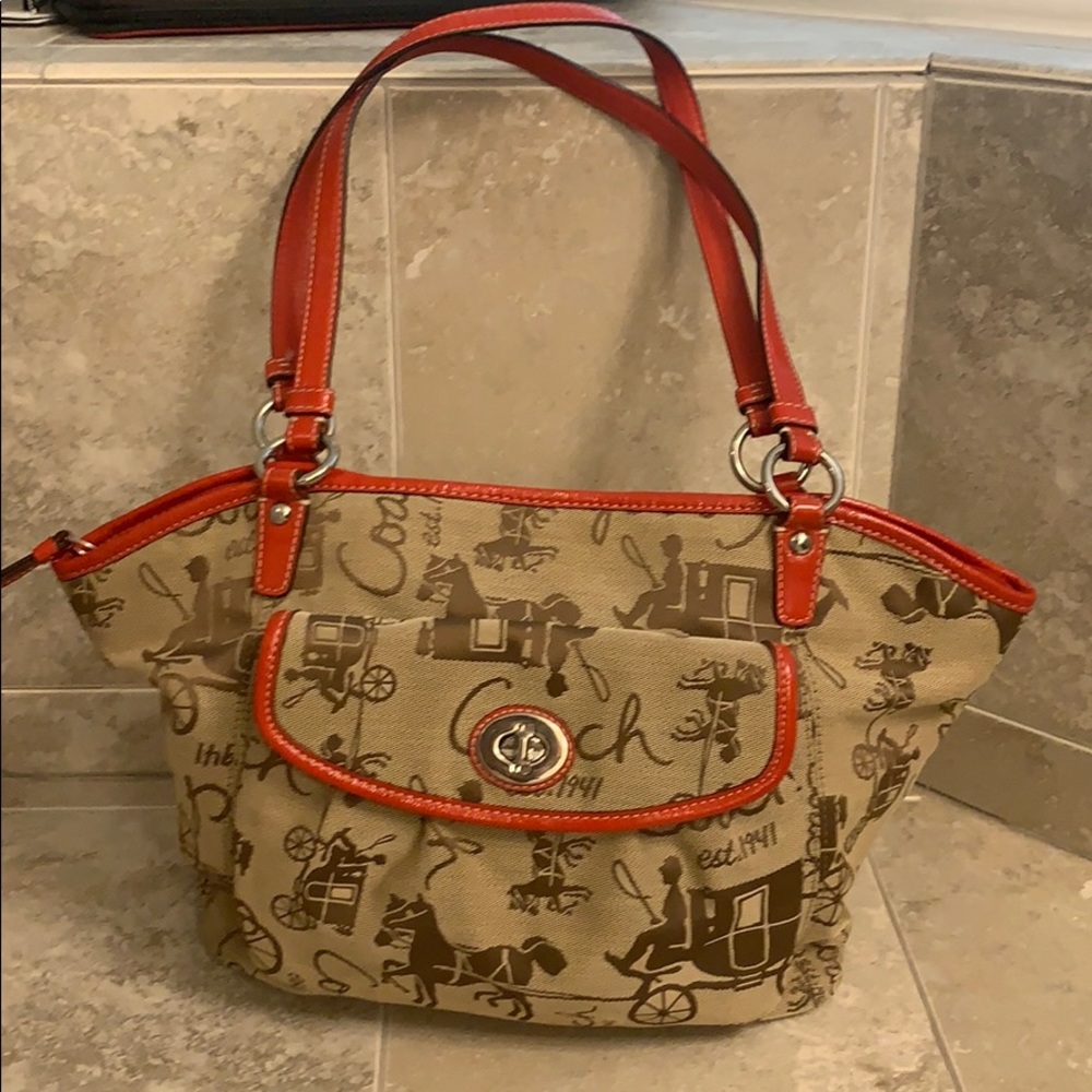Coach shoulder bag brown with red leather detail.